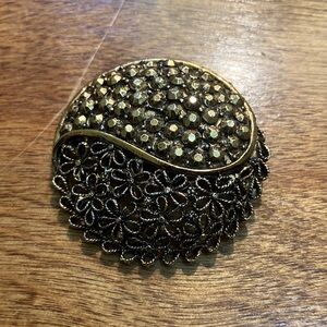 Elegant Gold and Black Floral Brooch